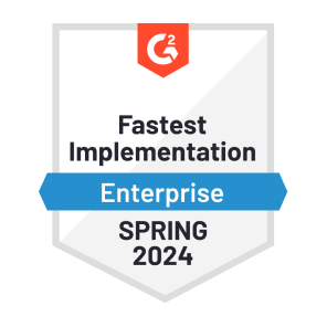 A red, blue, and white graphic of G2’s “Fastest Implementation - Enterprise” badge that Dashlane was awarded in spring 2024