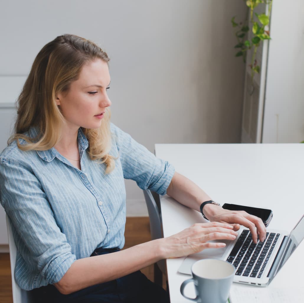 A woman on her laptop uses Dashlane to generate a secure username.
