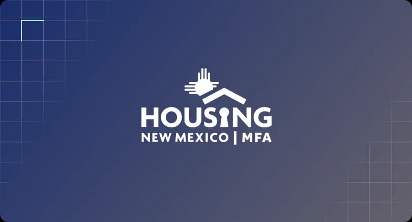 Housing New Mexico company logo centered on a dark blue grid background.
