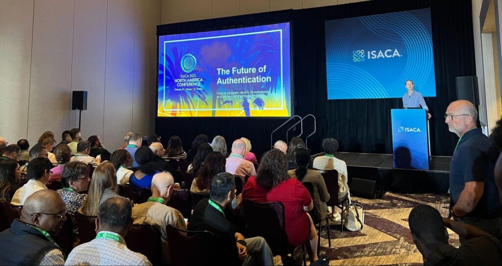 Dashlane CTO Frederic Rivain speaks to a packed room of IT and security professionals at the ISACA 2025 North America Conference in Orlando in May 2025. His talk covered the future of authentication and the evolving threat landscape.