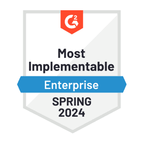 A red, white, and blue graphic of G2’s “Most Implementable - Enterprise” badge that Dashlane was awarded in spring 2024
