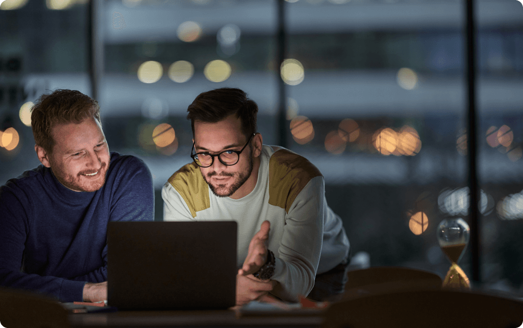 A man works at his computer, protected as he browses by Dashlane Omnix.