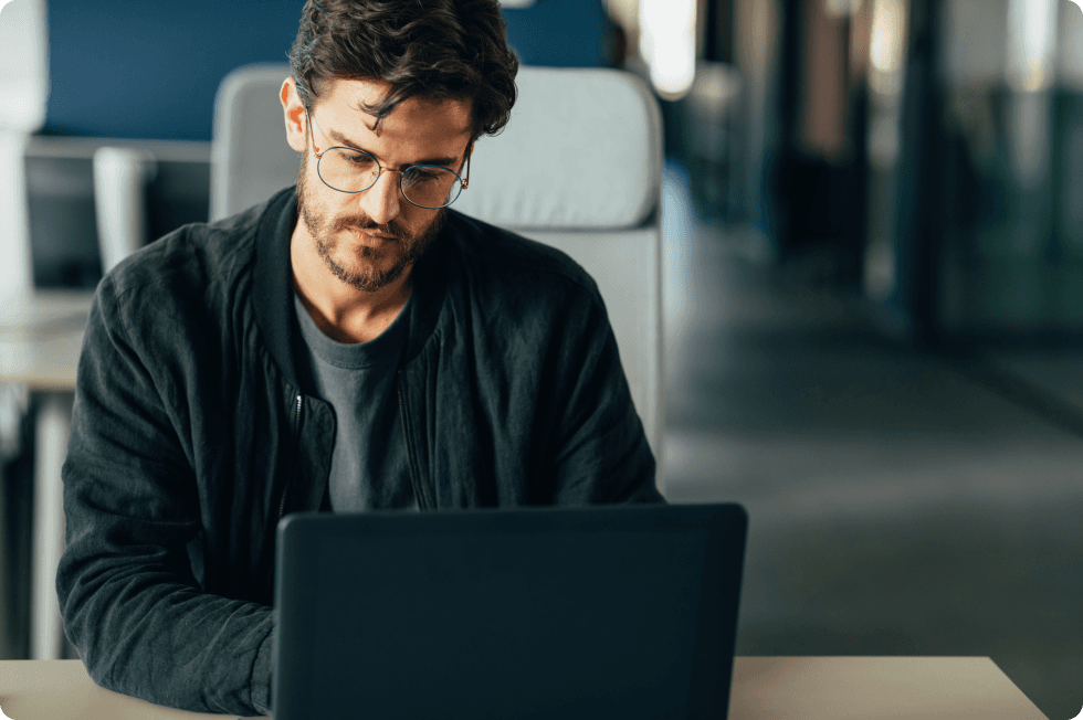 A man works at his computer.