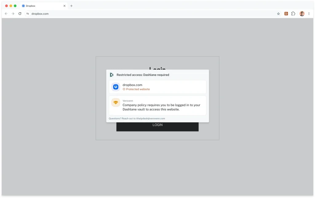 Screenshot of a browser showing dropbox.com's login form dimmed out and blocked by a Dashlane modal titled "Restricted access: Dashlane required." The modal flags dropbox.com as a protected website and states that the fictional company "Verovenn's" policy requires the user to be logged in to their Dashlane vault to access the site, with contact info for the IT help desk below. A button says “Log in to Dashlane.”