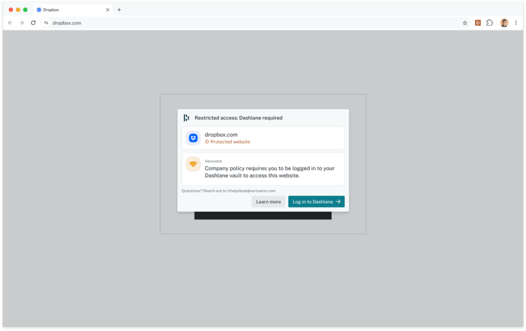 Screenshot of a browser showing dropbox.com's login form dimmed out and blocked by a Dashlane modal titled "Restricted access: Dashlane required." The modal flags dropbox.com as a protected website and states that the fictional company "Verovenn's" policy requires the user to be logged in to their Dashlane vault to access the site, with contact info for the IT help desk below. A button says “Log in to Dashlane.”